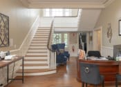 Thumbnail 25 of 41 - a view of the living room and stairs leading up to the second floor