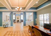 Thumbnail 6 of 31 - a dining room and living room with a table and chairs