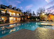 Thumbnail 30 of 38 - A large house with a pool in the backyard.