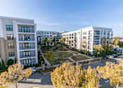 Thumbnail 48 of 49 - A view of a courtyard surrounded by apartment buildings.