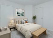 Thumbnail 20 of 28 - A bedroom with a bed, nightstands, and a painting on the wall.