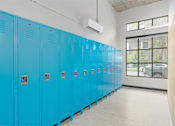 Thumbnail 25 of 33 - A row of blue lockers in a room.