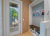 Thumbnail 11 of 28 - A bathroom with a window and a wall of decorative stickers.