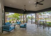 Thumbnail 21 of 23 - a covered patio with tables and chairs and a ceiling fan at Orion Prosper Lakes, Prosper, TX, 75078