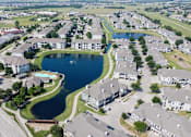 Thumbnail 38 of 38 - A bird's eye view of a residential area with a large lake in the middle.