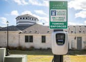 Thumbnail 23 of 23 - a parking meter in front of a building with a tooting enforced sign  at Orion Prosper Lakes, Texas