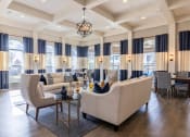 Thumbnail 10 of 23 - a living room with couches and chairs and a table  at Orion Prosper Lakes, Texas