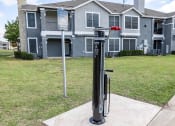 Thumbnail 22 of 23 - a parking meter in front of an apartment building  at Orion Prosper Lakes, Prosper, Texas