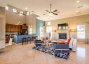 Thumbnail 7 of 33 - the living room is open to the kitchen and dining area  at Orion Prosper, Prosper, TX