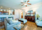 Thumbnail 4 of 33 - a living room with a couch and a chair  at Orion Prosper, Prosper, TX