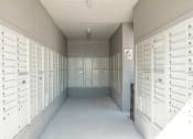 Thumbnail 13 of 33 - a long hallway with rows of lockers in a building at Orion Prosper, Prosper, TX, 75078