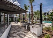 Thumbnail 50 of 53 - Outdoor grill and kitchen courtyard at The Citizen at Waterset in Apollo Beach, FL