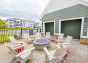 Thumbnail 29 of 40 - patio with chairs and fire pit