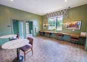 Thumbnail 21 of 40 - cyber cafe space with private tables and bar seating