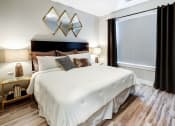 Thumbnail 6 of 50 - Bedroom with lamps at Icon Apartment Homes at Ferguson Farm, Montana