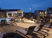 Thumbnail 41 of 50 - Night view of pool at Icon Apartment Homes at Ferguson Farm, Bozeman