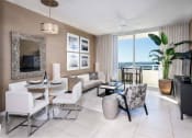 Thumbnail 10 of 14 - a living room with a large window and a view of the ocean at Regatta at New River, Florida