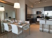 Thumbnail 8 of 14 - a dining room and kitchen with a table and chairs at Regatta at New River, Fort Lauderdale, 33301 at Regatta at New River, Fort Lauderdale Florida