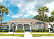 Thumbnail 7 of 15 - a house with palm trees in front of it