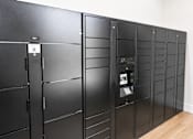Thumbnail 32 of 35 - A row of black lockers in a room.