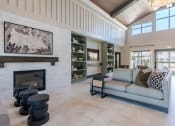 Thumbnail 3 of 43 - a living room with a couch and a fireplace