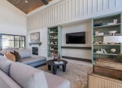 Thumbnail 5 of 43 - a living room with a couch and a tv