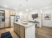 Thumbnail 2 of 24 - a kitchen with a counter top and a