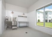 Thumbnail 20 of 54 - a kitchen with a stainless steel sink and a large window