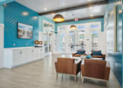 Thumbnail 11 of 24 - A blue and white room with a brown chair and a white table.