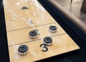 Thumbnail 7 of 21 - a shuffleboard table in the lobby of a hotel