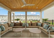 Thumbnail 53 of 65 - A patio with a sofa set and a table.