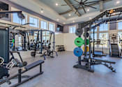 Thumbnail 13 of 40 - A spacious home gym with a variety of exercise equipment.