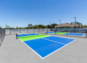Thumbnail 36 of 40 - A tennis court with blue and green colors.