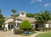 Thumbnail 2 of 18 - a house with a lawn and trees in front of it