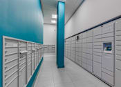 Thumbnail 29 of 35 - A row of lockers with a blue column in the middle.