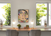 Thumbnail 13 of 35 - a painting of a woman on a wall next to a desk