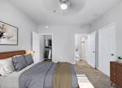 Thumbnail 7 of 29 - A bedroom with a bed, dresser, and a painting on the wall.