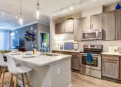 Thumbnail 17 of 49 - a kitchen with stainless steel appliances and a white counter top