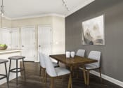 Thumbnail 27 of 49 - a dining room with a table and chairs