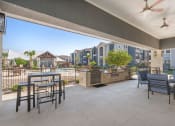 Thumbnail 25 of 44 - Gathering Area With Grills And Corn Hole at Residence at Midland, Midland, TX, 79706