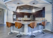Thumbnail 7 of 44 - Clubhouse Kitchen Breakfast Bar with Stoolsat Residence at Midland, Texas, 79706