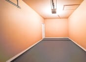 Thumbnail 57 of 69 - a empty room with orange walls and a gray floor