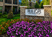 Thumbnail 40 of 40 - A building with the sign Rue 108 in front of it.