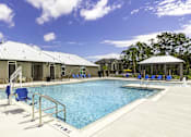 Thumbnail 21 of 32 - A pool with a metal railing and a sign that says "VETERANS" on the side.