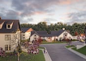 Thumbnail 10 of 11 - Gallatin, TN, Luxury Apartments Near ALDI - Vintage Bakers Crossing - Pathway With Modern Buildings, Curved Road, Landscaped Lawns, and Flowering Trees.