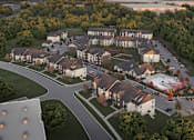 Thumbnail 23 of 24 - A large building complex surrounded by trees.