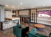 Thumbnail 11 of 30 - A modern living room with a television and comfortable seating at Saba Pompano Beach, Pompano Beach, 33062