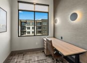 Thumbnail 28 of 94 - a conference room with a window and a desk and chairs
