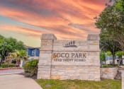 Thumbnail 3 of 31 - the entrance to scooby park apartment homes at sunset