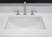 Thumbnail 45 of 54 - a white sink with a faucet on a counter top